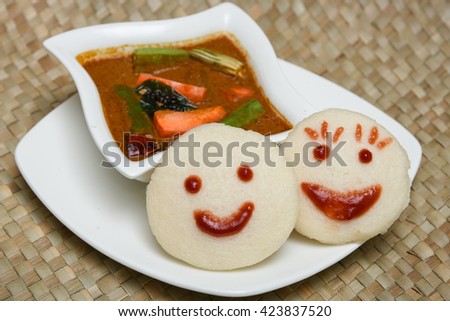 Popular South Indian breakfast idli or idly made of lentil, rice batter, with side dish sambar Kerala, India. Indian breakfast food. steamed food.