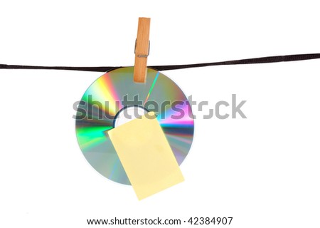 a disk hangs on clothes-pin on a rope
