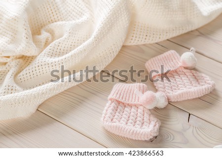 Baby goods on light wooden table