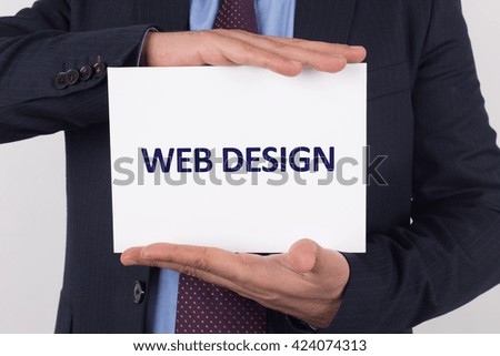 Man showing paper with WEB DESIGN text