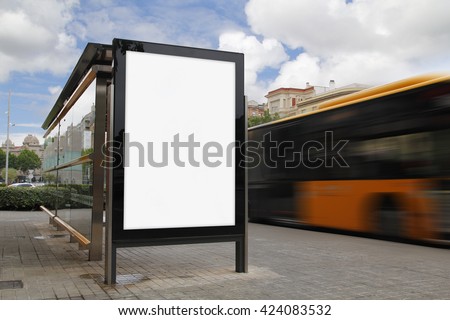 Bus stop with blank billboard, with blurred motion bus Royalty-Free Stock Photo #424083532