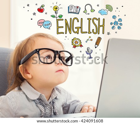 English concept with toddler girl using her laptop