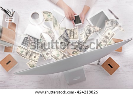 Financial concept. Make money on the Internet. Businesswoman works at office.