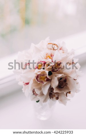 Nice and beautiful bridal orchid bouquet on the window