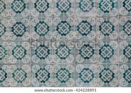 traditional azulejos tiles on facade of old house in Portugal