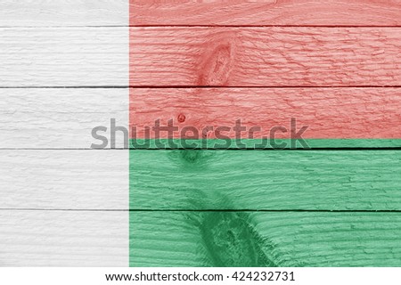 Flag of Madagascar on a wood plank