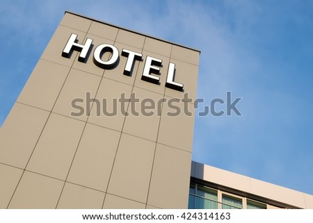 hotel sign against blue sky