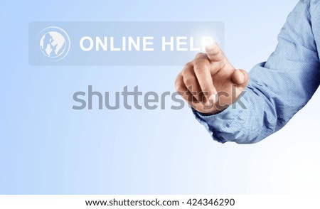 Hand pressing online help button on blue background