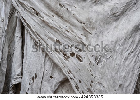 Old dirty torn rag Royalty-Free Stock Photo #424353385