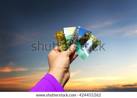 Male hand holding seasons cards