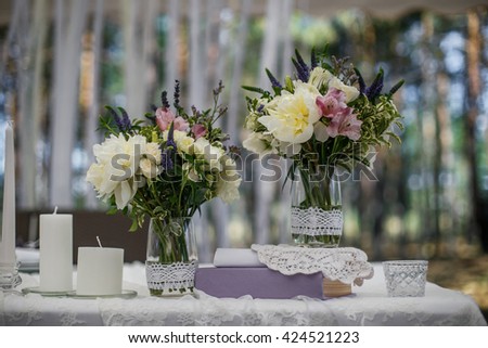 Beautiful flower and candle wedding decoration in restaurant