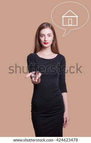 Realtor is giving the keys to an apartment to clients, studio photo on a light background. elegant young woman with gorgeous hair and makeup