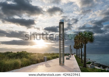Promenade in South Pointe Park at sunshine with dramatic sky. Miami Beach, Florida.