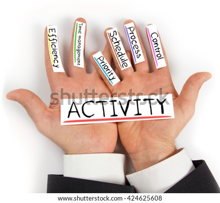 Photo of hands holding paper cards with ACTIVITY concept words