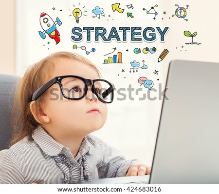 Strategy concept with toddler girl using her laptop