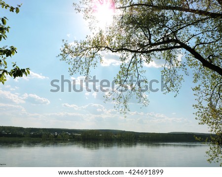 Beautiful landscape, forest, field and sky .Top view summer. Calming countryside. Summer nature river landscape. River grass summer view. Silent blue river near a road.blue sky reflecting on water.