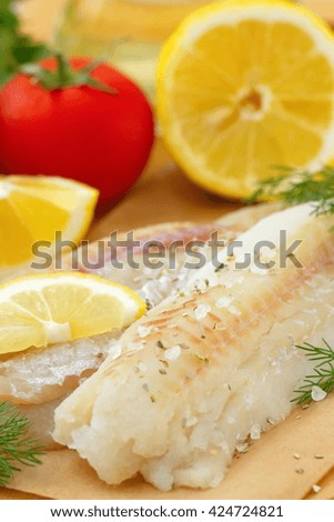 Raw fish with spices, lemon and vegetables
