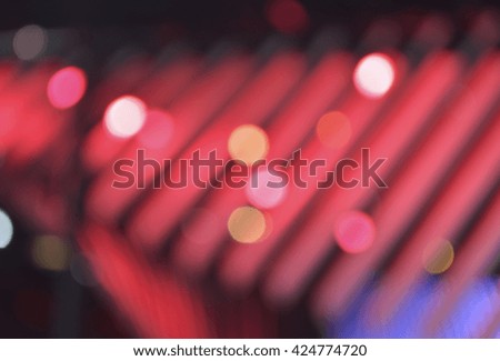 Defocused light and shadow of light bulb, red tone, abstract bac