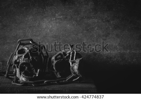 Prisoner's skull with chain in jail. still life photography with skull. dark tone image skull. black and white photo. 