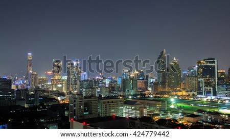  night light of Bangkok. Panoramic and perspective view  light blue background of glass high rise building skyscraper commercial  of future. Business concept of success industry tech architecture
