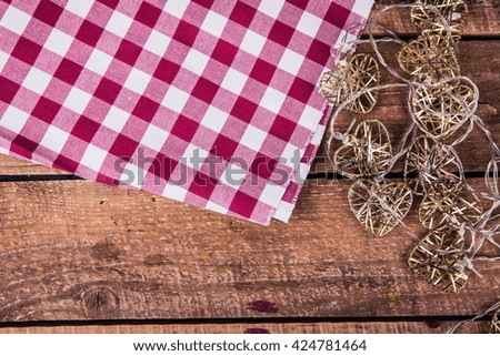 garland of hearts on the wooden background