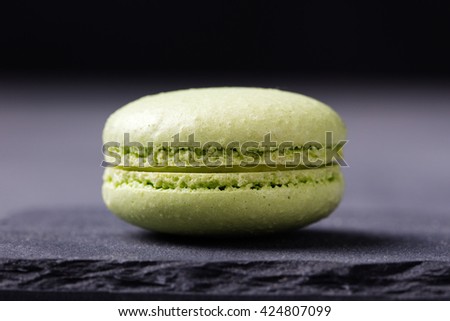 Colorful French Macarons on the slate stone background Copy space