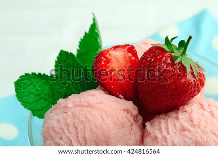 Delicious ice cream with strawberries closeup 