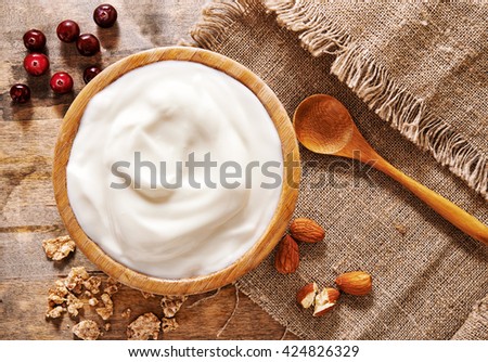 bowl of yogurt, berries and nuts. top view Royalty-Free Stock Photo #424826329