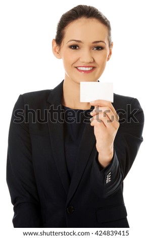 Businessswoman holding empty card.