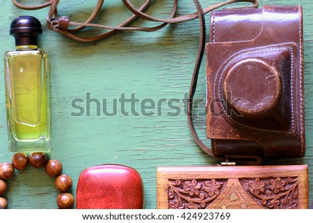 Creative arrangement of natural things with vintage camera and men's casual travel accessories, wooden background, space for text, flat lay