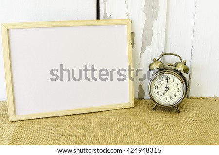 white board and retro clock on the table