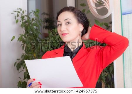 Business woman holding the document. Photo can be used as a whole background.