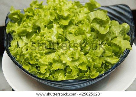 This is a close-up of lettuce salad on glass
