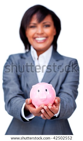 Hispanic Businesswoman holding a piggybank against a white background