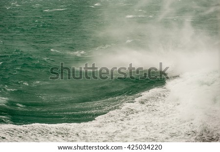 Ocean waves wind, rain during the monsoon season.
