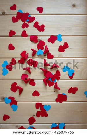 Paper hearts on wooden background, selective focus
