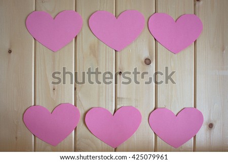 Paper hearts on wooden background, selective focus
