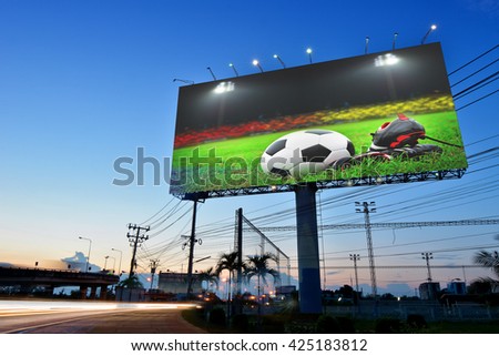 Football in the field advertising on billboard