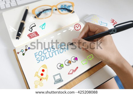 drawing icon cartoon with FOCUS ON SOLUTION concept on paper in the office 