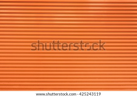 old steel rolling shutter background (orange color)