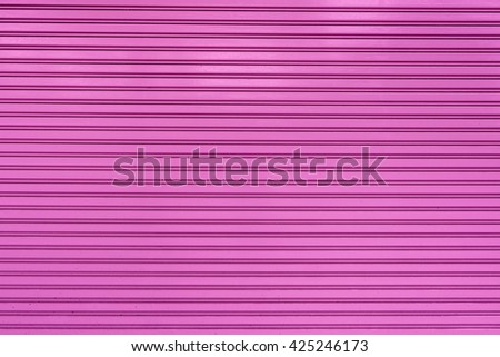 old steel rolling shutter background (pink color)
