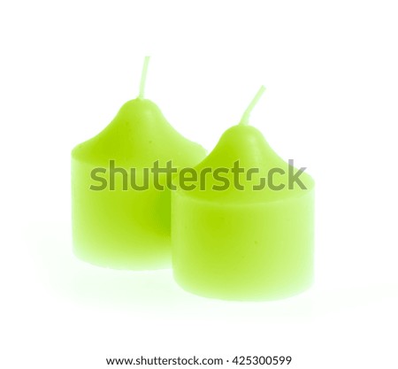 green candle isolated on white background