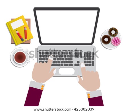 Hand on laptop keyboard with blank screen monitor and book, pencil, tea cup, donuts