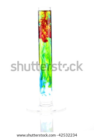 a flower vase filled with water and blue, green, red and yellow food coloring, isolated on white