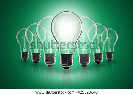 Idea and  leadership concept -  incandescent light bulb on the color background