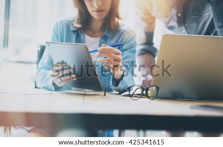 Photo Sales Manager Working Modern Office.Bearded Man Use Generic Design Laptop.Account Department Work New Startup Project.Researching Process at Wood Table.Horizontal.Burred Background.Film effect