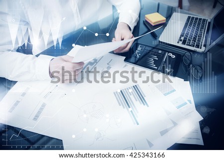 Investment management process.Photo trader work market report documents.Use electronic device.Work graphics icons,stock exchanges reports interface.Business project startup.Horizontal,film effect.