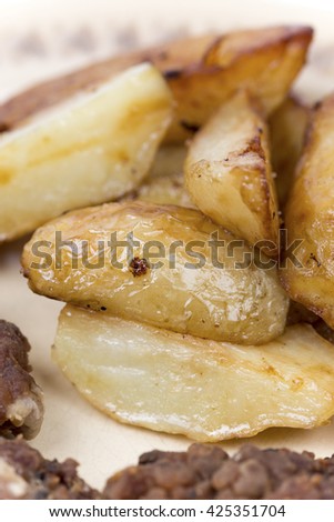 Close up macro fried young potatoes.