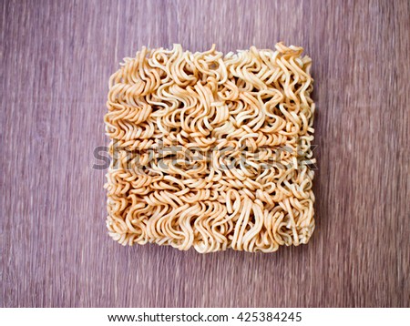 Instant noodles on wood background, texture instant noodles