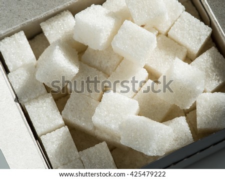 Close up shot of white refinery sugar. Royalty-Free Stock Photo #425479222